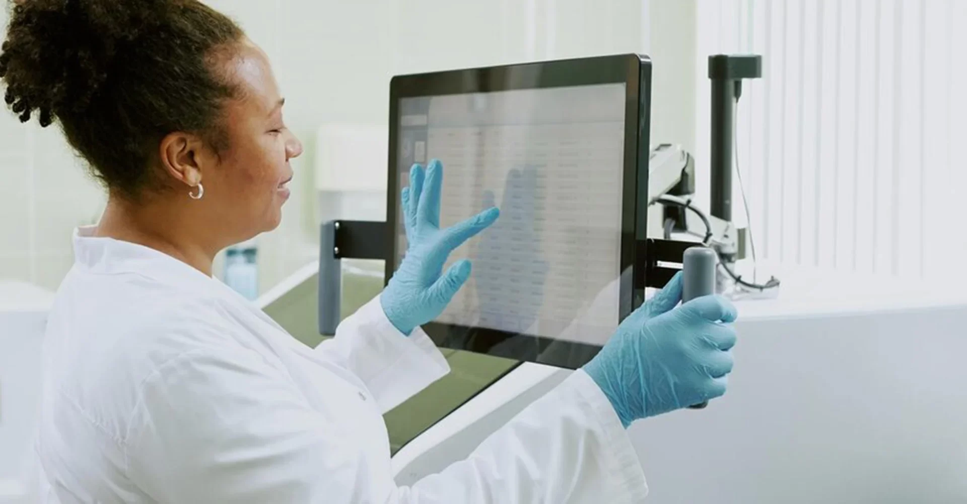 Bethel Trading Solutions researcher using touchscreen device while conducting experiment